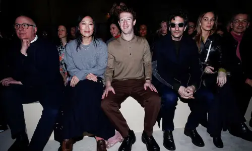Prada layers winter jackets over light dresses at Milan show as Zuckerberg&rsquo;s presence fuels smart glasses talk
