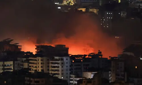 Israeli airstrikes pound Beirut suburb, Hezbollah warns Israelis