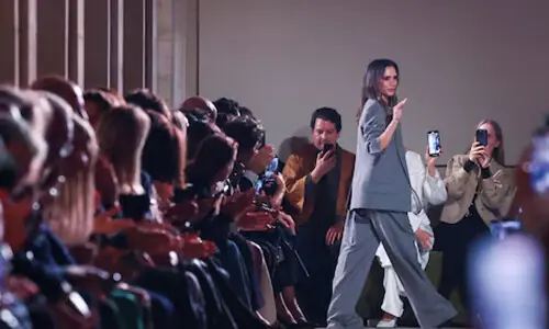 Victoria Beckham shows sheer dresses and sharp suits at Paris Fashion Week