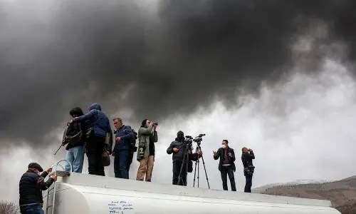 Tehran plunged into darkness by smoke from burning oil