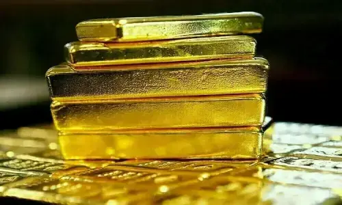 Gold set for third weekly fall on hawkish US Fed, elevated dollar
