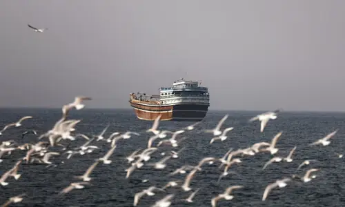 Vessels attempting to cross Hormuz report gunfire
