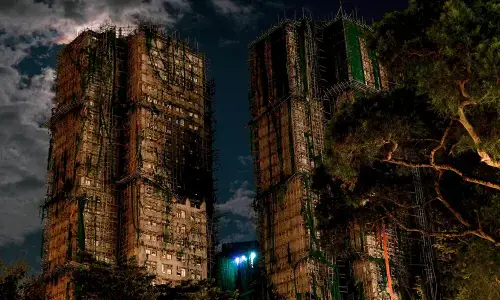Hong Kong fire victims scour scorched homes for keepsakes