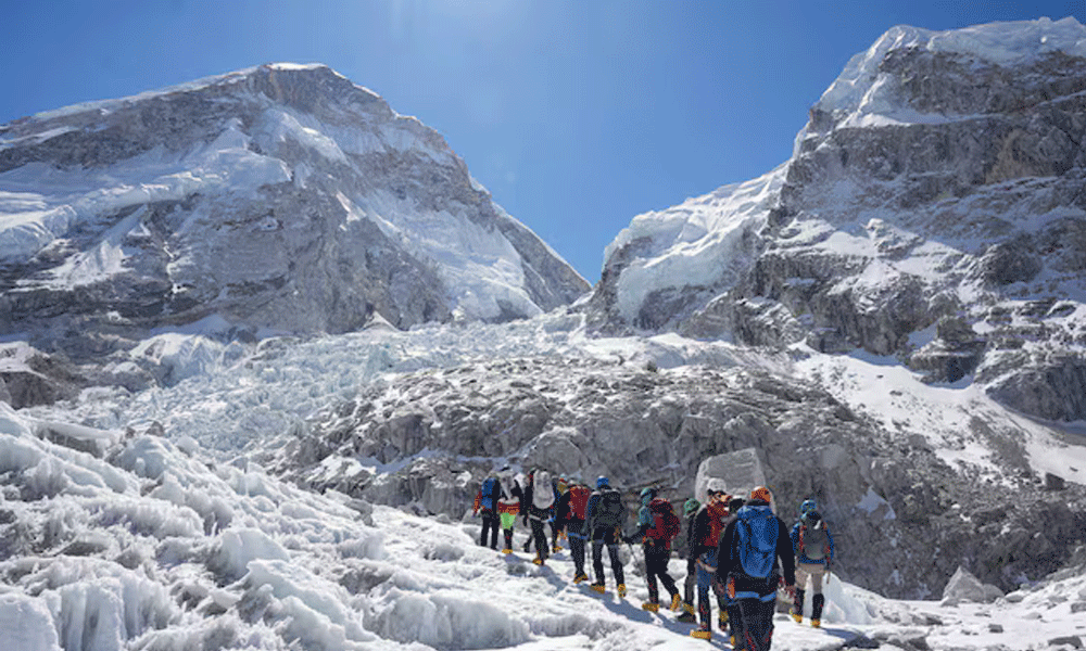 Sherpas cross icefall, open route for climbers to move up on Everest
