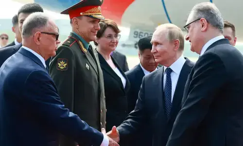 Putin lands in China for trip that aims to show unshakeable ties after Trump pomp