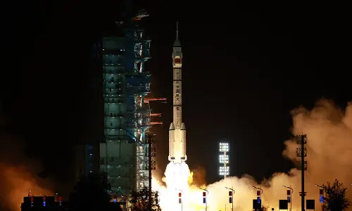 China launches three-crew space flight as part of Moon ambitions China launches three-crew space flight as part of Moon ambitions