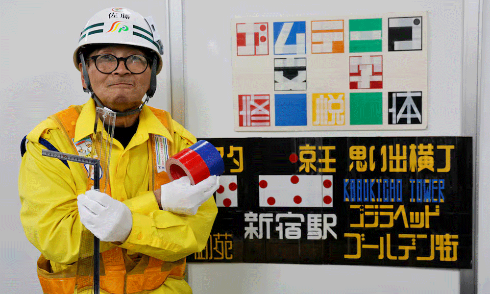 Japanese security guard finds fame as designer of duct tape signs