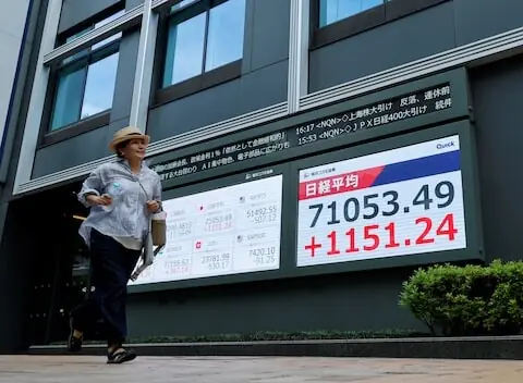 Stocks set records in Japan, South Korea; dollar gets Fed boost