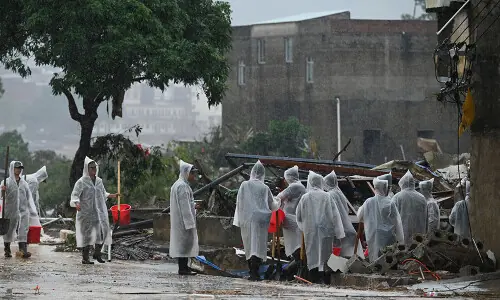 Rescuers search for survivors of China storms as super typhoon nears