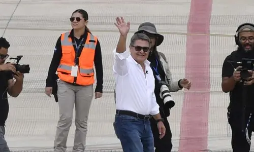 Honduran ex-president returns home after Trump pardon