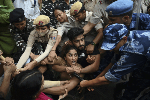 India suspends policeman for firing AK-47 at student protesters