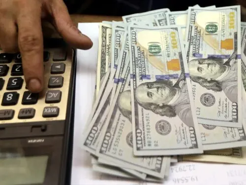 Dollar eases against yen