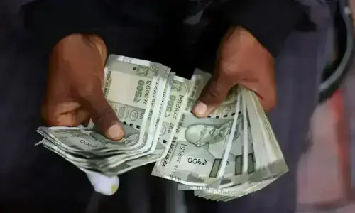 Competing cues, caution ahead of RBI policy decision keep Indian rupee nearly flat
