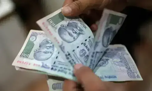 Indian rupee nudges up on RBI intervention; investors eye inflation data