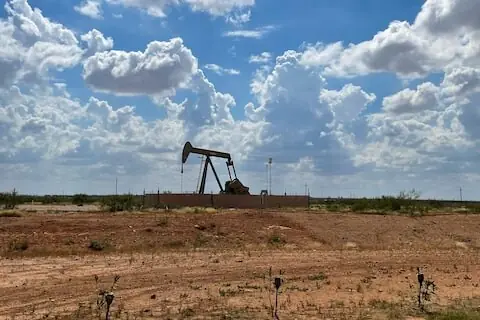 Oil slides on clues about Fed policy, rumors of Hormuz deal