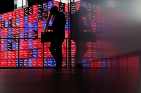 Shares skid in Asia as oil rises, rate hikes loom
