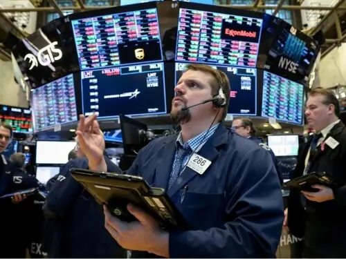Wall St rises on AI gains as oil slides