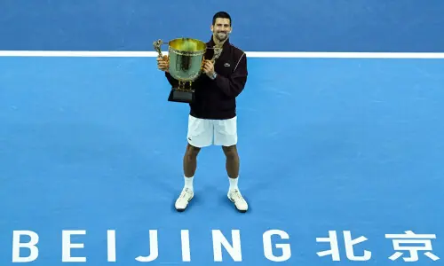 Djokovic wins China Open as de Minaur retires injured