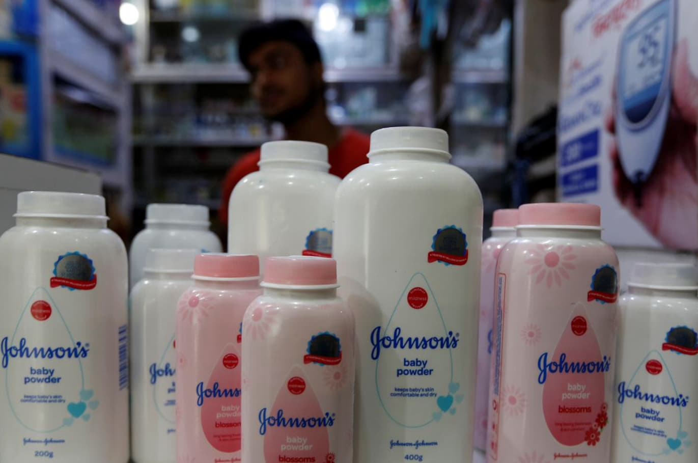 FILE PHOTO: A worker waits for customers as bottles of Johnson & Johnson baby powder are displayed at a medical store in Kolkata, India, December 20, 2018. REUTERS/Rupak De Chowdhuri FILE PHOTO: A worker waits for customers as bottles of Johnson & Johnson baby powder are displayed at a medical store in Kolkata, India, December 20, 2018. REUTERS/Rupak De Chowdhuri