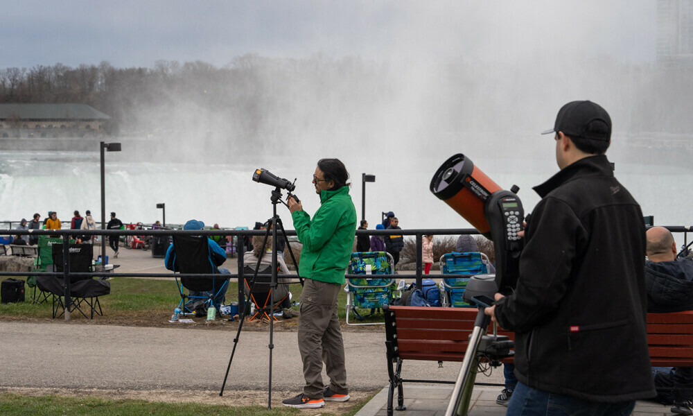 NIAGARA FALLS: People set up their binoculars and telescopes ahead of the Solar Eclipse on April 8, 2024 in Niagara Falls, New York. Photo: AFP
