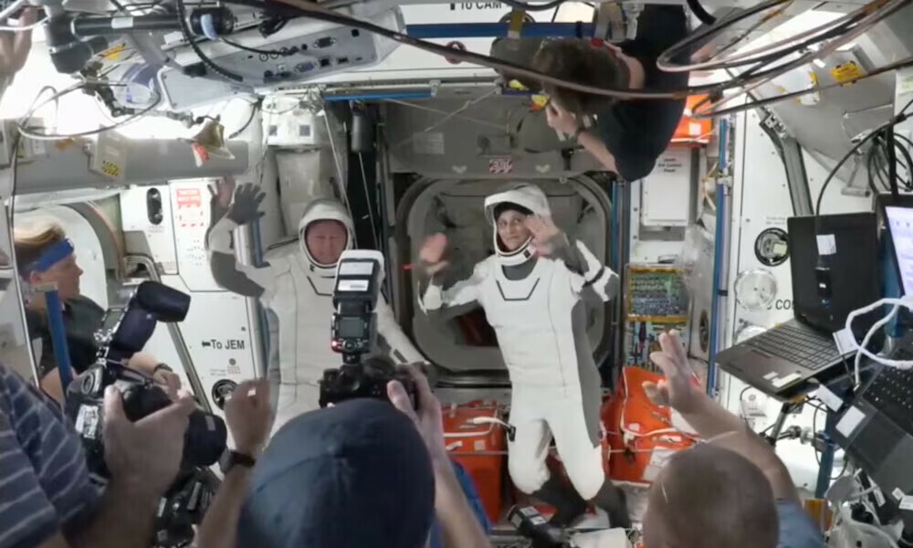 Butch Wilmore and Suni Williams, two veteran NASA astronauts who have been stuck on the International Space Station for nine months, wave at the hatch of a SpaceX Crew Dragon capsule before closing the hatch in preparation for undocking from the ISS to begin their return to Earth. Photo: Reuters
