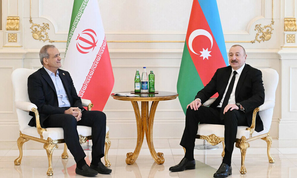 In this handout picture taken and released by the Azerbaijani presidency on April 28, 2025, Azeri President Ilham Aliyev meets with his Iranian counterpart Masoud Pezeshkian in Baku. Photo: AFP