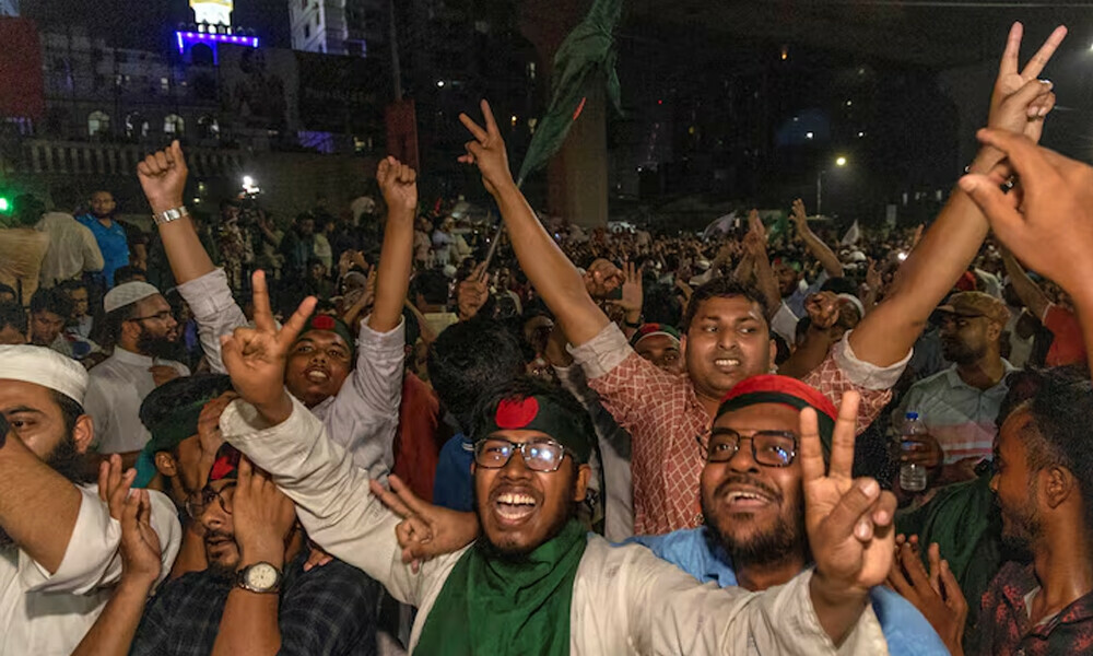 People celebrate after the interim government officially banned all the activities of the Bangladesh Awami League, until the trial of the party and its leader, following the demand of the protesters, in Dhaka, Bangladesh. Photo: Reuters
