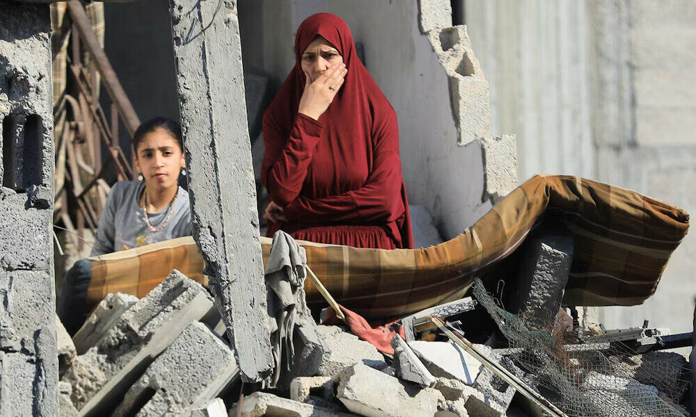 Palestinians inspect the site of an Israeli strike on a house in Jabalia, in the northern Gaza Strip May 23, 2025. REUTERS