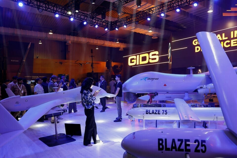Visitors inspect the Global Industrial & Defence Solutions (GIDS) unmanned combat aerial vehicle (UCAV) Shahpar during the International Defence Exhibition and Seminar (IDEAS 2024) in Karachi, Pakistan. Photo:  Reuters