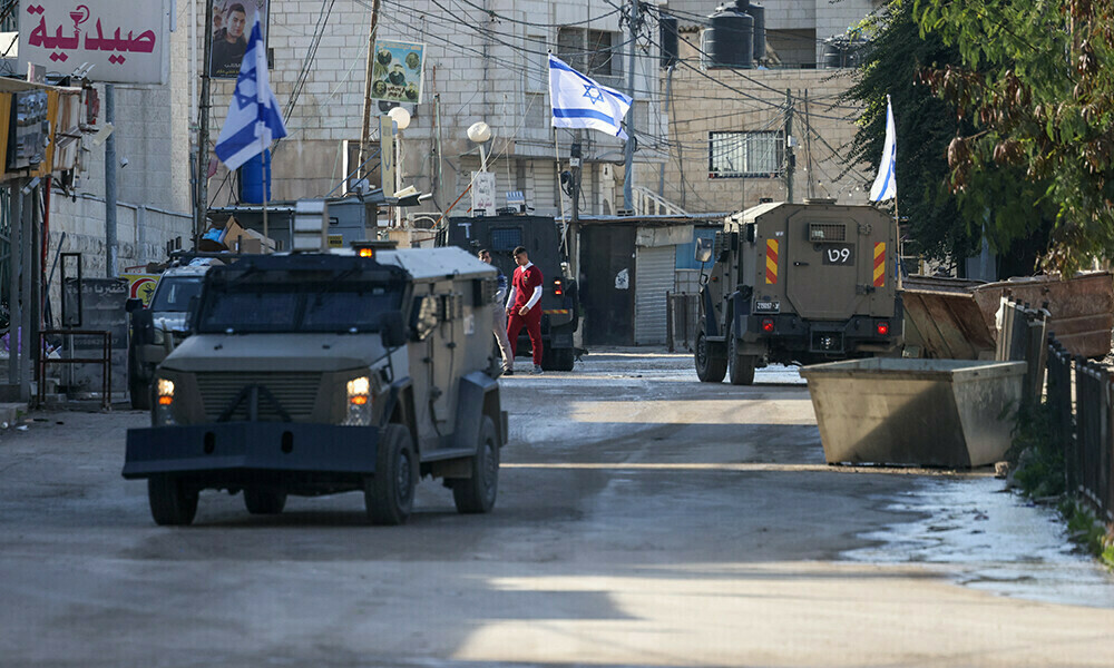 Israeli forces in armoured vehicles conduct a raid in Jenin in the occupied West Bank. Photo: AFP