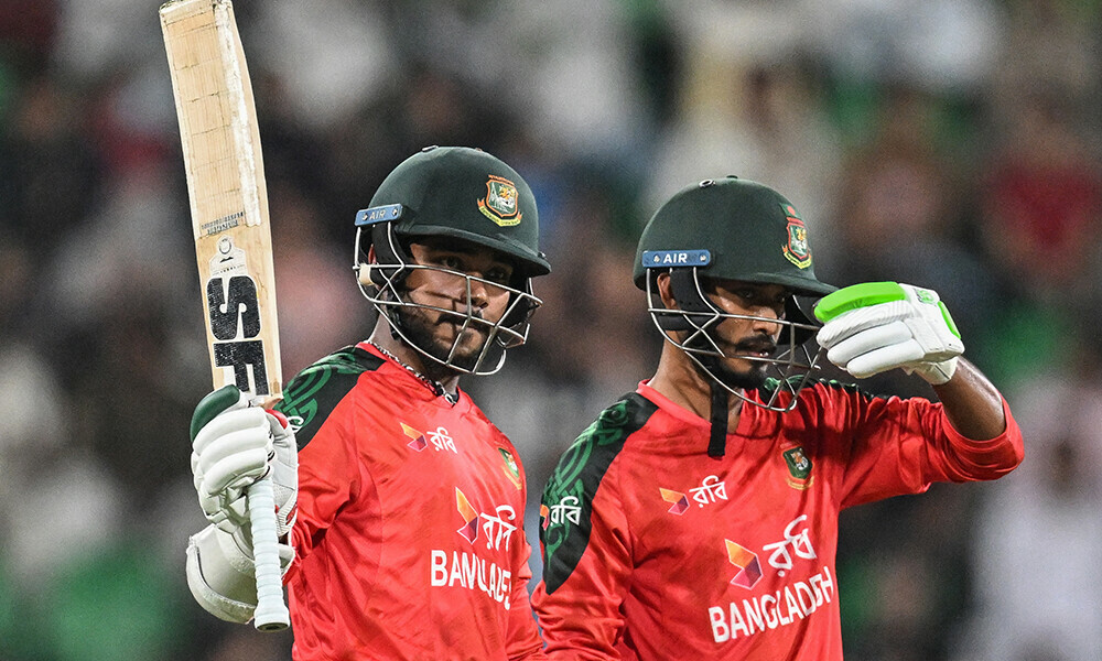 Bangladesh’s Parvez Hossain (L) celebrates after scoring a half-century (50 runs) as his teammate Tanzid Hasan looks on during the third and final Twenty20 international cricket match between Pakistan and Bangladesh at the Gaddafi Cricket Stadium in Lahore on June 1, 2025. Photo: AFP