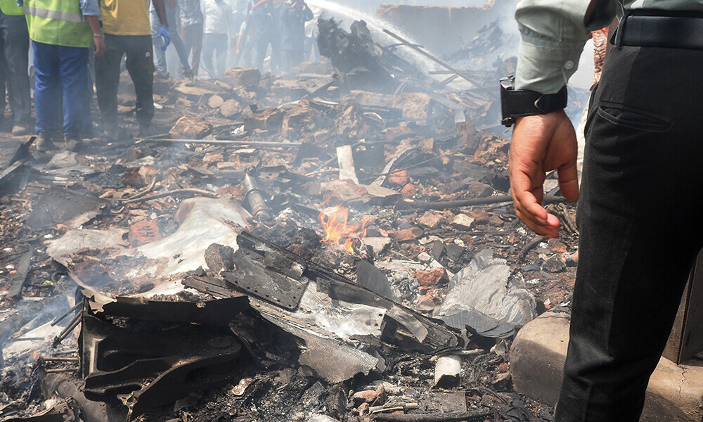 Debris is seen at the site where Air India flight 171 crashed in a residential area near the airport in Ahmedabad on June 12, 2025. Photo: AFP