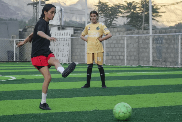  Fahima Qayyum (L) practices with other players at a football ground in Gilgit, in the Gilgit-Baltistan region of Pakistan. Photo: AFP 