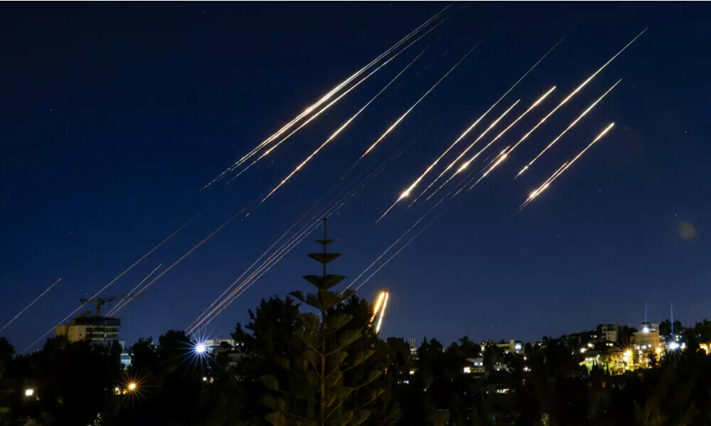 Missiles fired from Iran in the night sky over Occupied Jerusalem. Photo: AFP