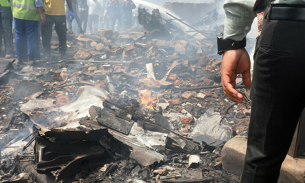 Debris is seen at the site where Air India flight 171 crashed in a residential area near the airport in Ahmedabad on June 12, 2025. Photo: AFP