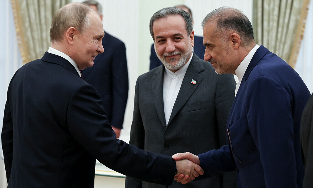 Russian President Vladimir Putin welcomes Iranian Ambassador to Russia Kazem Jalali and Iranian Foreign Minister Abbas Araqchi during a meeting at the Kremlin in Moscow, Russia. Photo Reuters