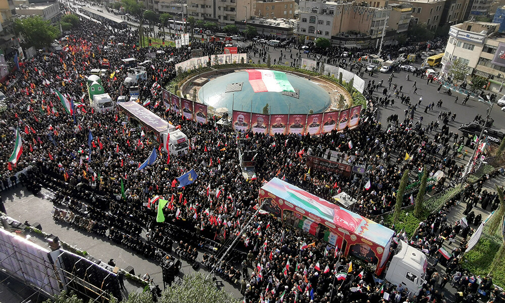 Images of Iranian military commanders and scientists killed during Israeli strikes are displayed at Enqelab Square as trucks carrying their coffins drive past during their funeral procession in the capital Tehran on June 28, 2025. Photo: AFP