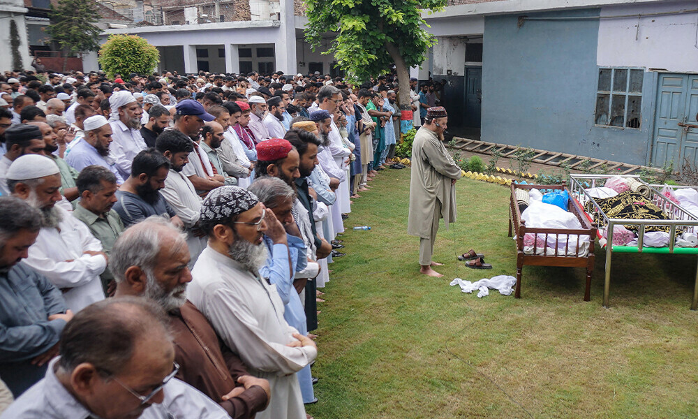 Residents and relatives offer funeral prayers for the victims who died in flash floods in Sialkot, in Punjab province, on June 28, 2025. Flash flooding in Pakistan&rsquo;s mountainous northwest has killed 11 people, including several children, at the start of the monsoon season, disaster management officials said. Photo: AFP