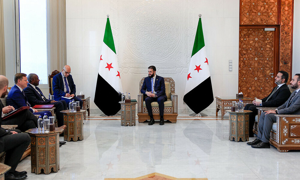 A handout picture released by the official Syrian Arab News Agency (SANA) shows Syria&rsquo;s interim President Ahmad Al-Sharaa (C) meeting with British Foreign Secretary David Lammy (3rd-L) in the Syrian capital Damascus on July 5, 2025. Photo: AFP