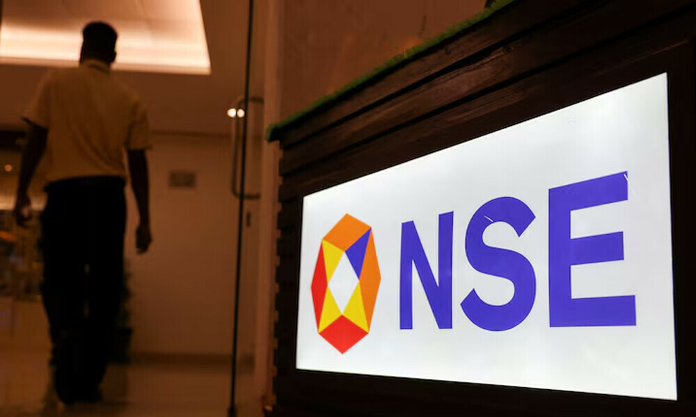 A man walks past the logo of the National Stock Exchange (NSE) in Mumbai, India, August 9, 2024. REUTERS