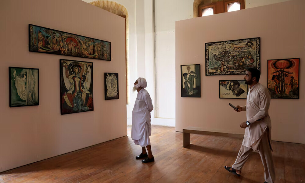  Visitors look at a collection of works by late Pakistani artist and calligrapher Sadequain Naqqash at the Frere Hall building, used as a town hall during the days of the British Colonial period, which now hosts an art gallery and library. Photo: Reuters 
