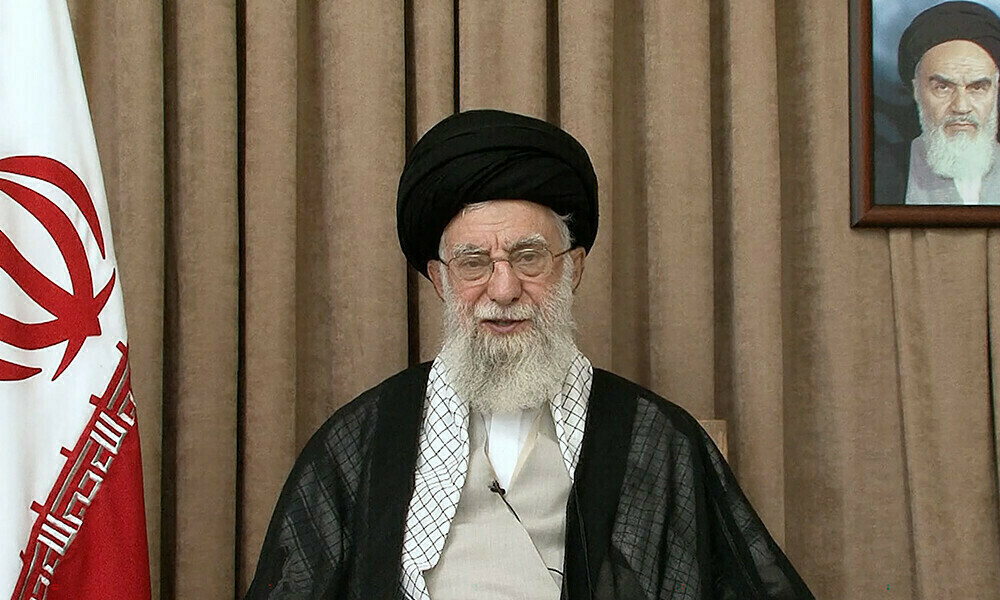 This image released by the office of Iran’s supreme leader, Ayatollah Ali Khamenei, on June 26, 2025 shows him addressing the nation in front of a portrait of his predecessor, the late founder of the Islamic republic Ayatollah Ruhollah Khomeini. Photo: AFP
