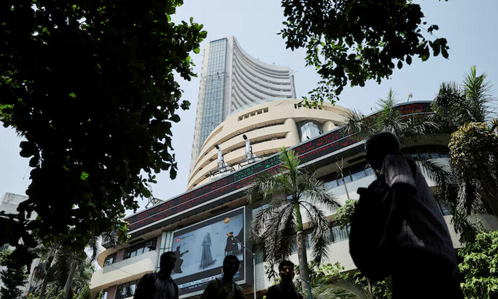 Men walk past a screen displaying market results outside the Bombay Stock Exchange (BSE) in Mumbai, India, April 7, 2025. File Photo: Reuters Men walk past a screen displaying market results outside the Bombay Stock Exchange (BSE) in Mumbai, India, April 7, 2025. File Photo: Reuters