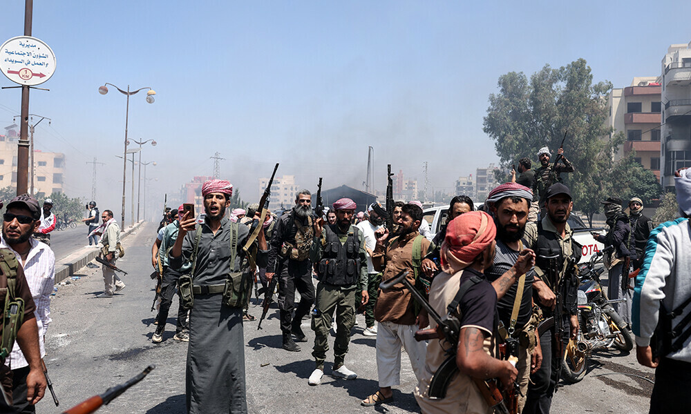 Beduin and tribal fighters gather in the northern part of the city of Sweida in southern Syria’s Druze majority province on July 19, 2025.  Photo: AFP