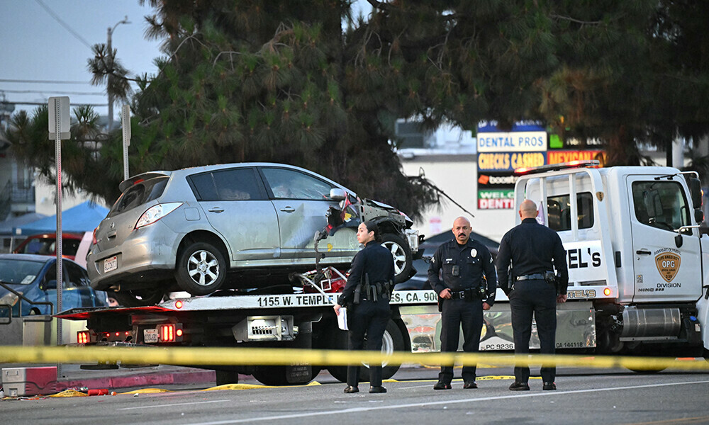 A crashed vehicle is being taken away on a truck after it drove into a crowd in Hollywood in the early hours of July 19, 2025, injuring 28 people, according to the Los Angeles Fire Department. Photo: AFP