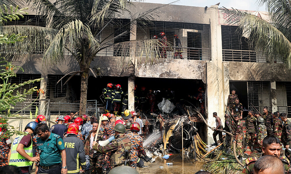 Bangladesh’s fire service and security personnel conduct a search and rescue operation after an Air Force training jet crashed into school in Dhaka on July 21, 2025. Photo: AFP Bangladesh’s fire service and security personnel conduct a search and rescue operation after an Air Force training jet crashed into school in Dhaka on July 21, 2025. Photo: AFP