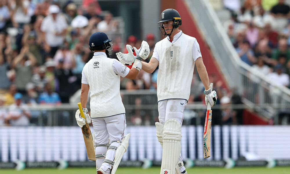England&rsquo;s Zak Crawley (R) celebrates his half century with England&rsquo;s Ben Duckett on day two of the fourth cricket test match between England and India at Old Trafford, in Manchester, north England, on July 24, 2025. Photo: AFP