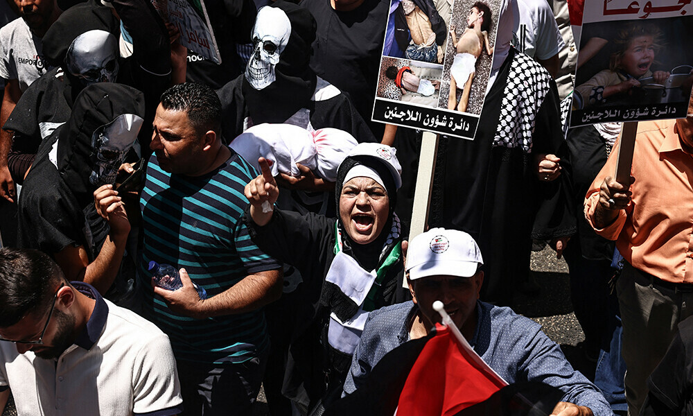 Demonstrators raise placards bearing pictures, during a protest in solidarity with the people of the Gaza Strip and Palestinian detainees, in the occupied-West Bank city of Ramallah on August 3, 2025. Photo: AFP