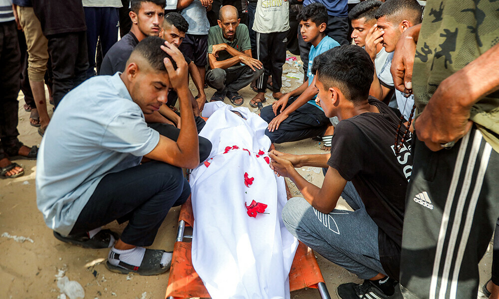 Mourners bid farewell to the body of one of the victims killed during overnight Israeli bombardment on a camp sheltering displaced people in the Mawasi area of Khan Yunis, during the funeral at Nasser Medical Complex in Khan Yunis in the southern Gaza Strip on August 5, 2025. Photo: AFP
