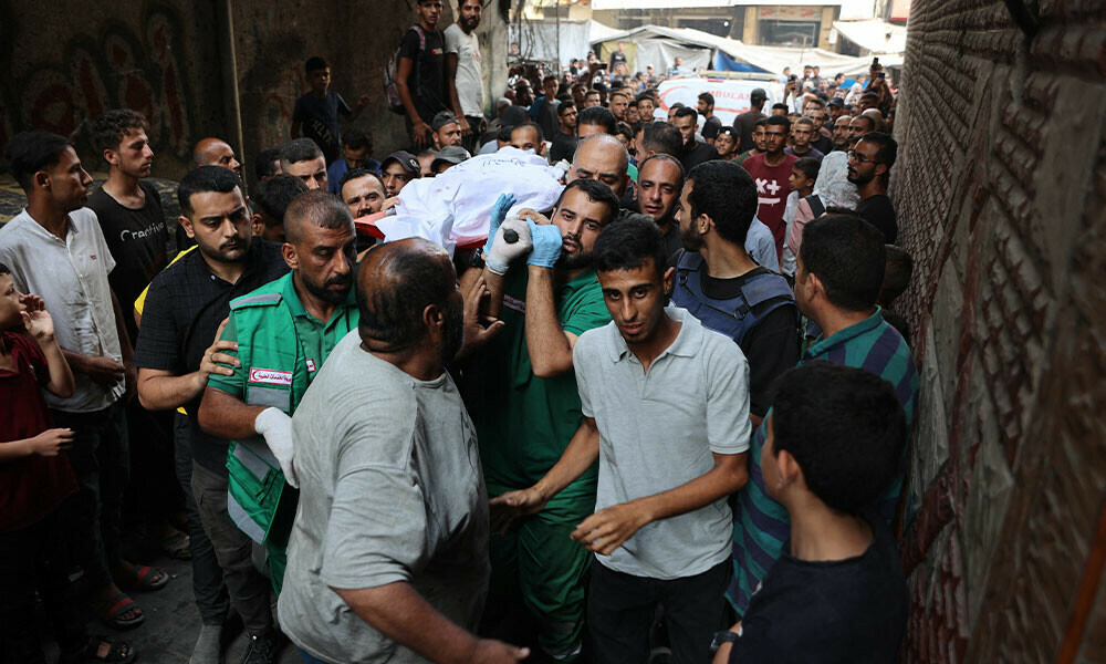 Mourners carry the body of Al Jazeera correspondent Anas al-Sharif, who was killed alongside other journalists in an overnight Israeli strike on their tent in Gaza City, during his funeral in Gaza City on August 11, 2025. Photo: AFP